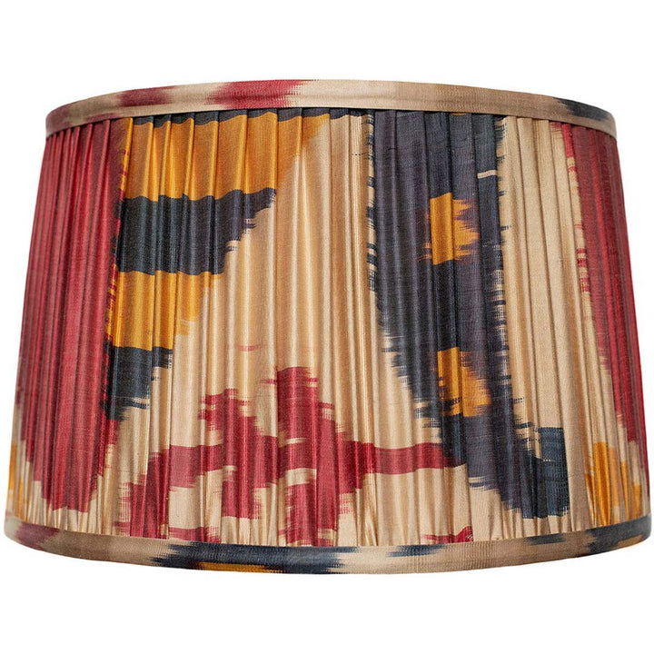 Front view of Mekhann's multicoloured ikat silk lampshade, displaying vibrant hand-pleated patterns with natural dyes.
