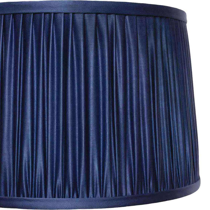 Close-up detail of the elegant pleating on Mekhann's navy blue silk lampshade, exemplifying fine craftsmanship.