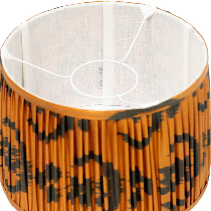 Inside look at Mekhann's orange ikat lampshade showing the delicate silk texture and the quality of the hand-pleating.