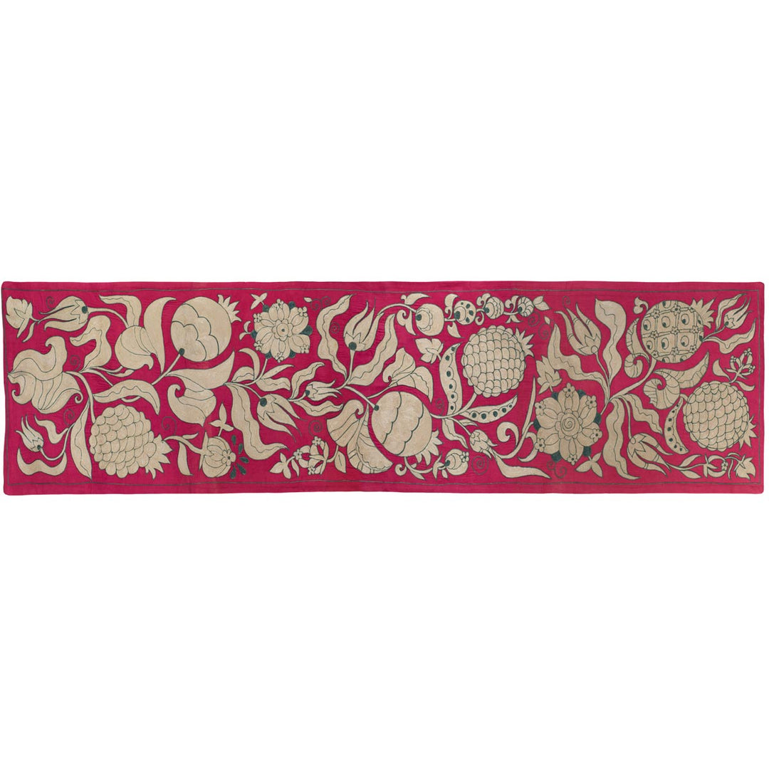 Horizontal front view of Mekhann's pink ottoman vines runner, showing an alternative position of the runner and a different way it can be used.