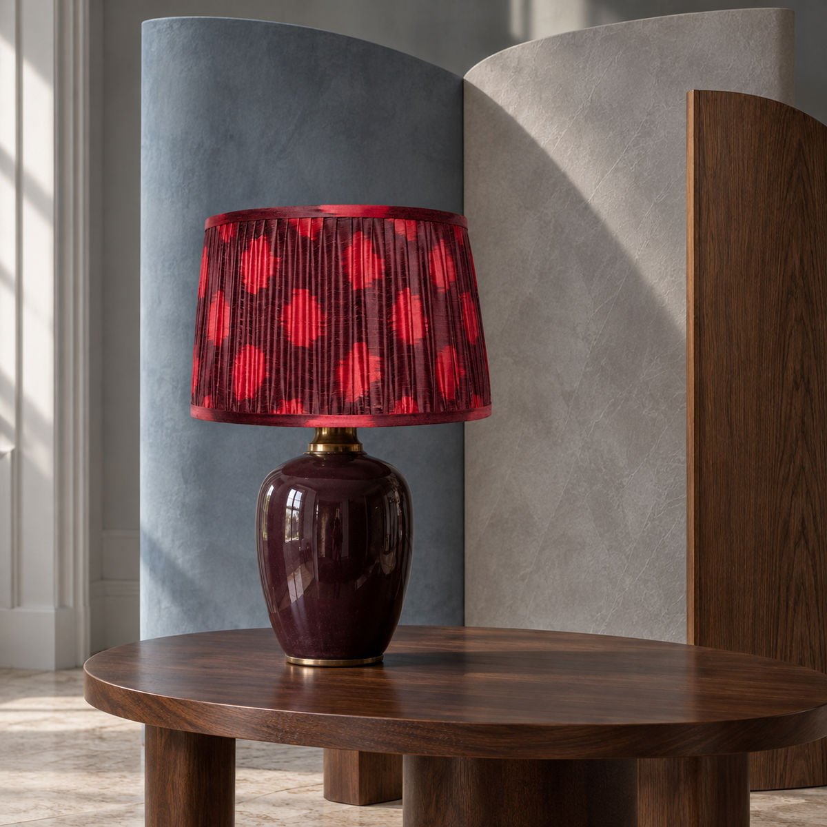 Polka Dot lampshade styled with curved blue-grey, ivory and walnut screens; illustrative editorial setting.