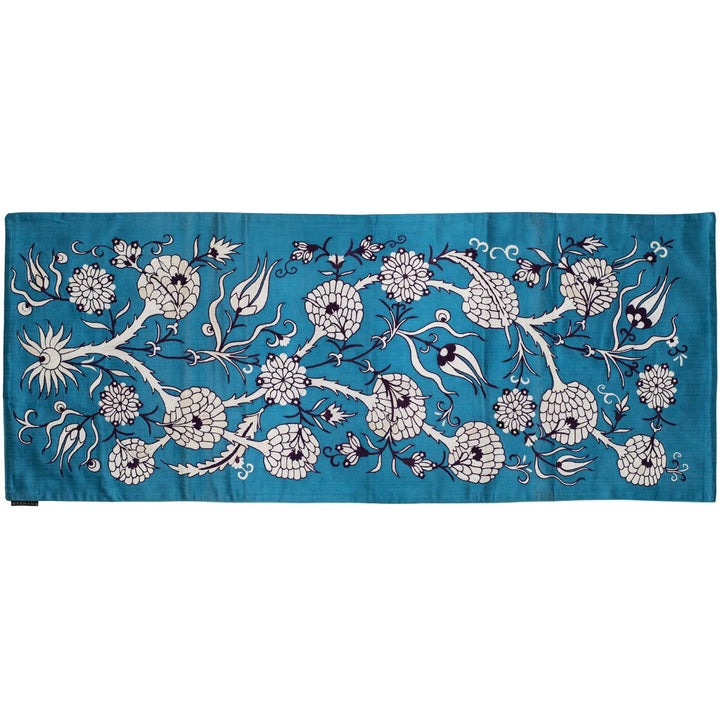 Horizontal front view of Mekhann's pomegranate vines runner, an elegant turquoise coloured throw with pomegranate vines embroidery.