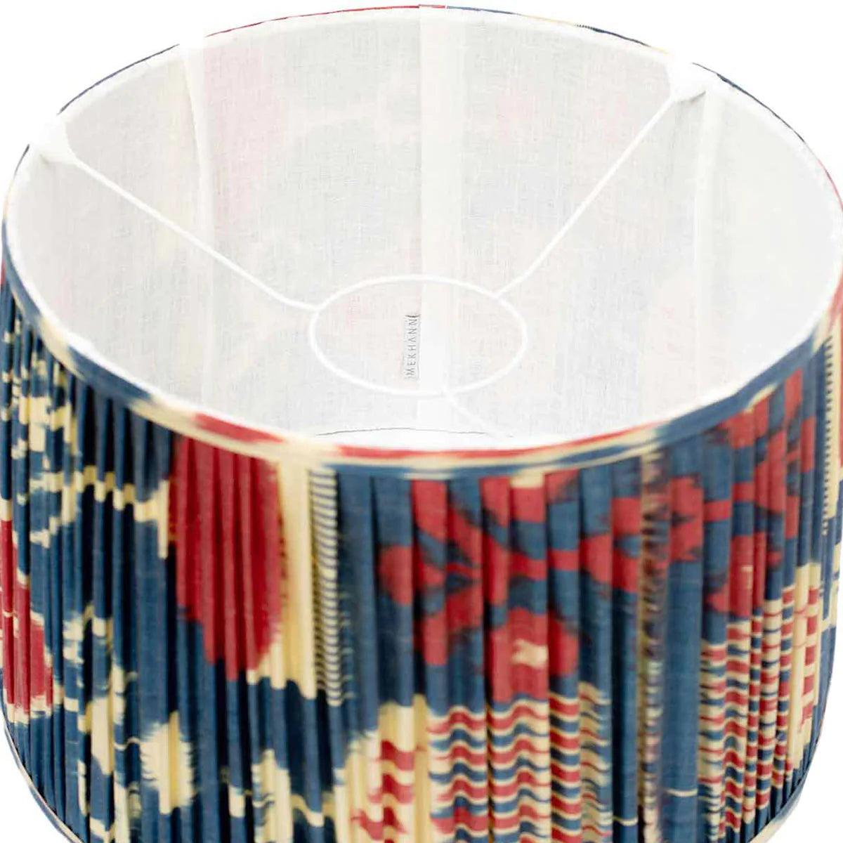 Interior shot of Mekhann's red and blue ikat lampshade, revealing the quality silk fabric and rich colour infusion.