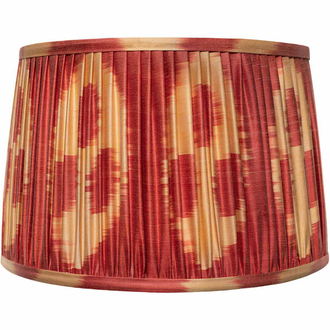 Front view of Mekhann's red and cream silk ikat lampshade, with hand-pleated detailing and natural vegetable dyes.