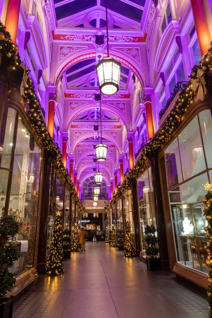 Decorative indoor hallway with purple lighting and Christmas decorations