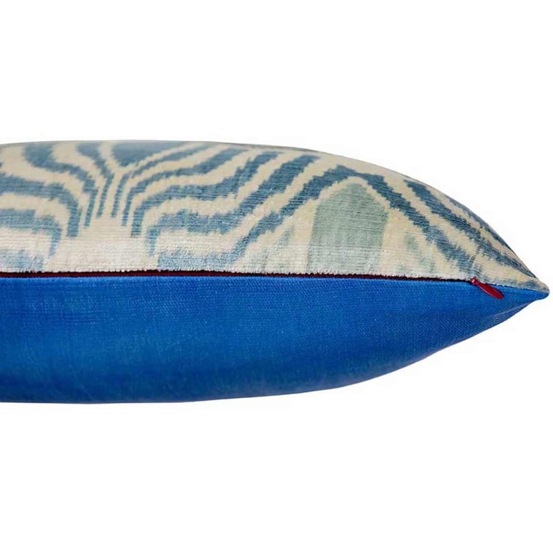 Side view of Mekhann's blue patterns velvet cushion, displaying how the front and back of the cushion join at the side, and also features a zip for easy access to the cushion pad.