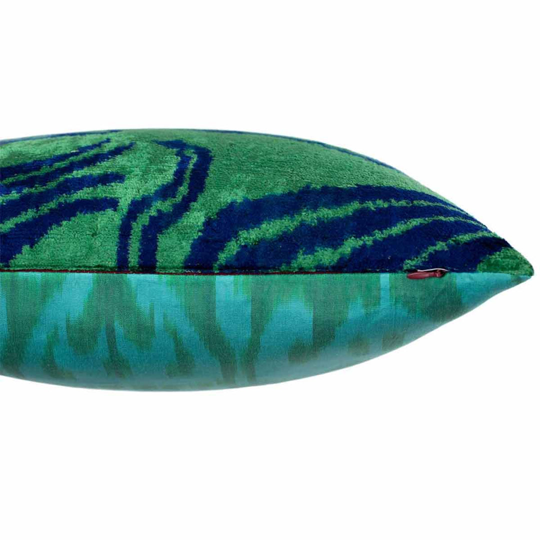 Side view of Mekhann's green tulips velvet cushion, where we can see the joining point of the front and back of the cushion.