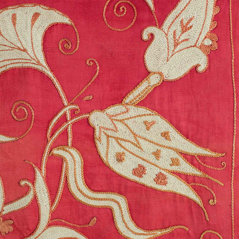 Close up view of Mekhann's pink tree of life throw, showing the intricate attention to details in the design of the tree of life design motifs.