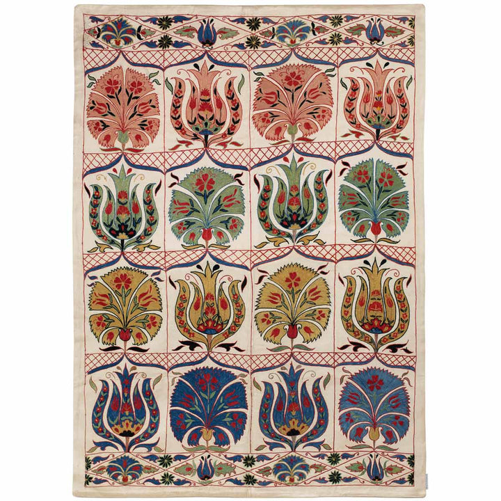 Front view of Mekhann's tulips and carnations throw, where we can see a full collection of tulips and carnations along with other classic design Motifs, that have come together on a cream silk base to create the composition the throw.