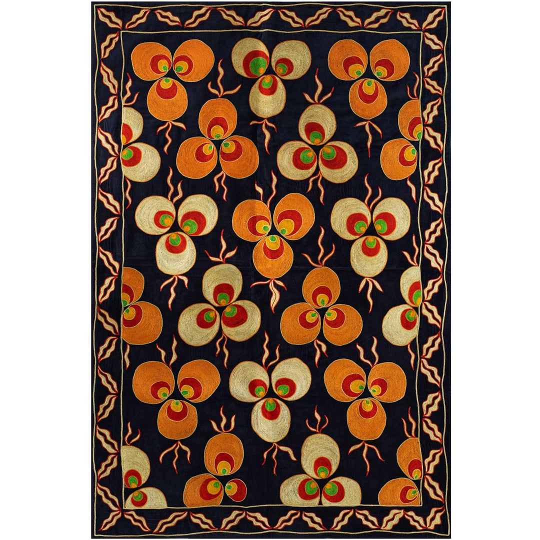 Front view of Mekhann's navy, velvet cintamani throw, showing the full composition of the navy, velvet hand embroidered cintamani throw. There main colours of the embroidery are orange, red, yellow, and green.