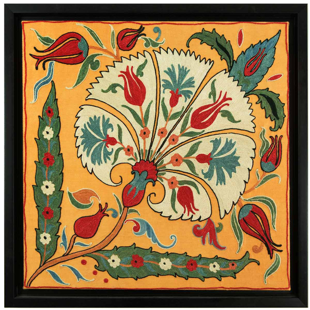 Front view of Mekhann's yellow silk carnations embroidered artwork, featuring one central cream carnation motif with red tulips inside the petals, all within a black frame.